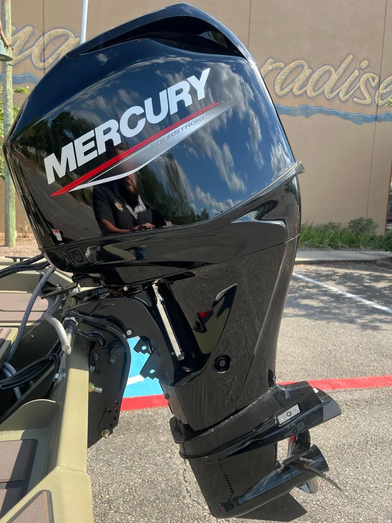 Slide: The Image of 2025 Tracker Grizzly 1754 SC with Mercury outboard motor in sunlight. - 5
