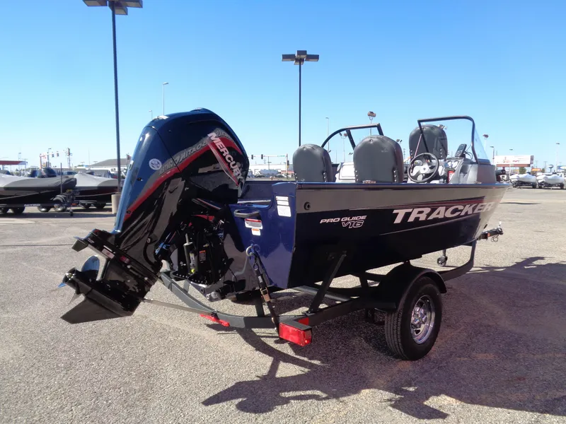Slide: The Image of 2025 Tracker Pro Guide V-16 WT boat on trailer, outdoor display. - 5