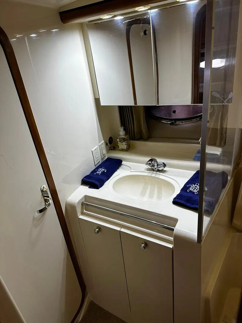 Slide: The Image of Bathroom interior of 2000 Carver 400 Express Yacht with sink and mirror. - 20