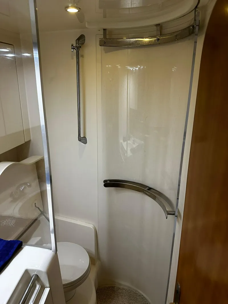Slide: The Image of Bathroom interior of 2000 Carver 400 Express Yacht with modern shower. - 22