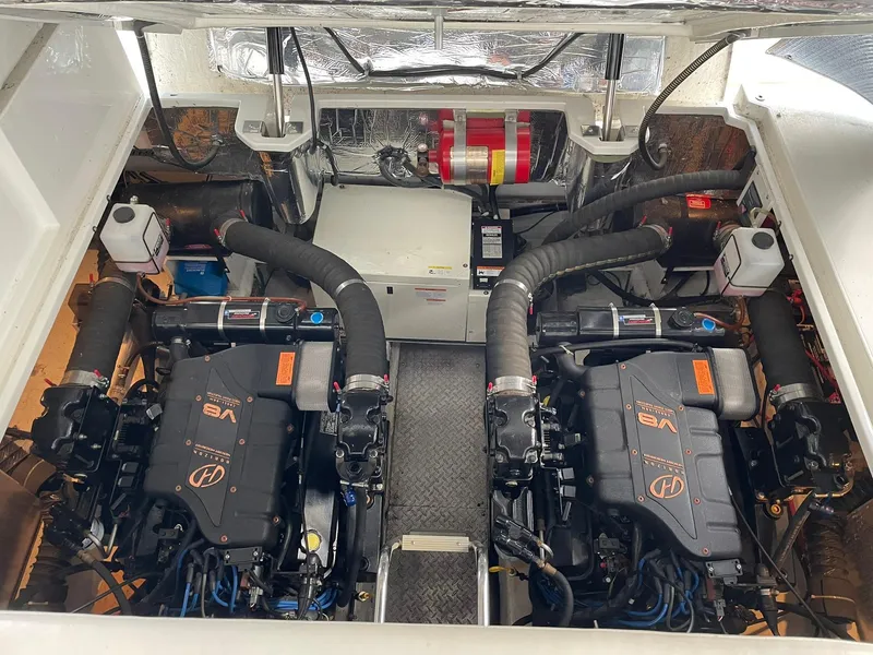 Slide: The Image of Engine room of 2000 Carver 400 Express Yacht with dual engines and equipment. - 24