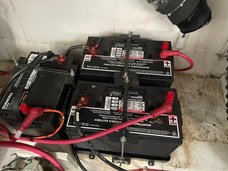 Slide: The Image of Battery setup in a 2000 Carver 400 Express Yacht engine compartment. - 25