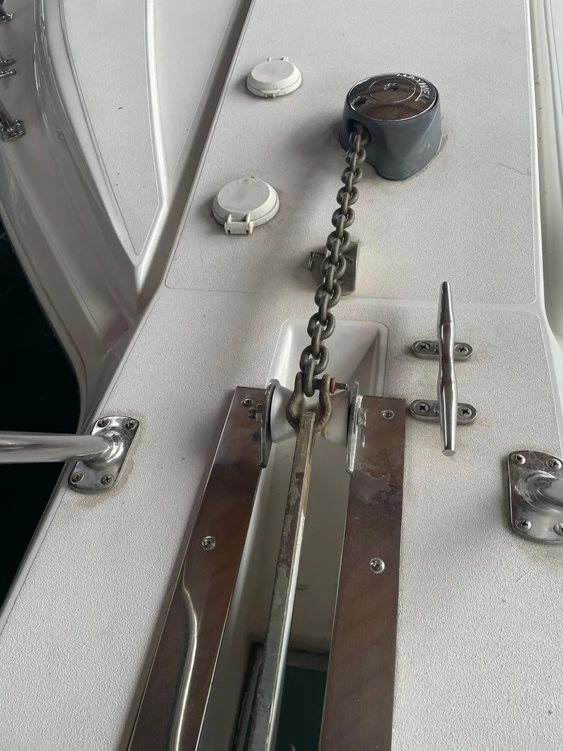 Slide: The Image of Anchor chain mechanism on 2000 Carver 400 Express Yacht deck. - 28