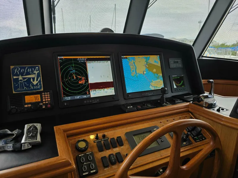 Slide: The Image of Ocean Alexander Classico 2010 yacht helm with navigation screens and controls. - 7