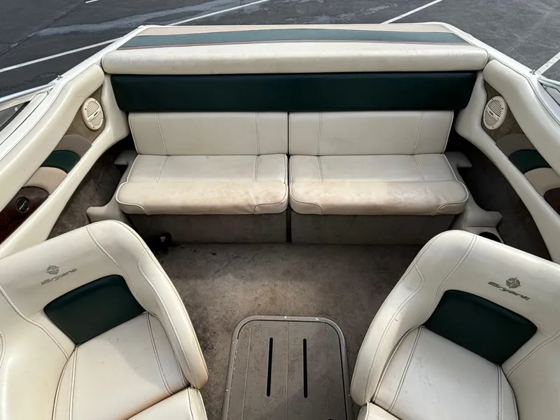 Slide: The Image of 2002 Bryant 214 boat interior with white and green seating. - 8