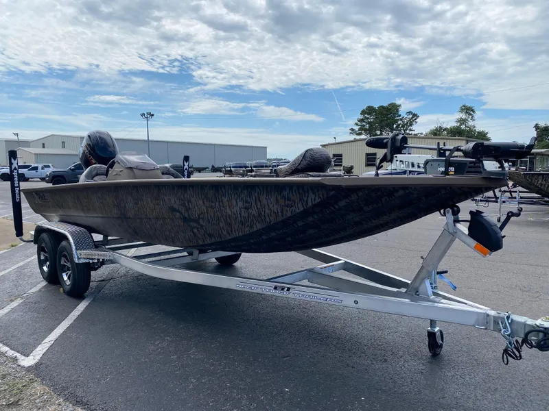 Slide: The Image of 2025 Xpress XP200 boat on trailer under cloudy sky. - 6