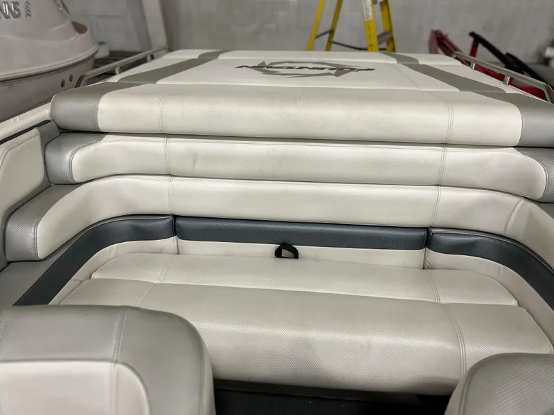 Slide: The Image of 1995 Fountain 24 Competition boat interior with white cushioned seating. - 14