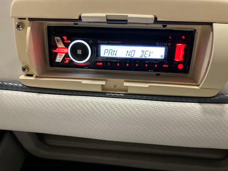 Slide: The Image of Sony car stereo in a 1995 Fountain 24 Competition boat dashboard. - 15