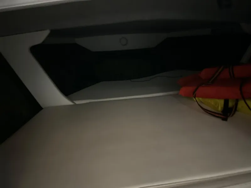 Slide: The Image of Interior of a 1995 Fountain 24 Competition boat with life jackets. - 16