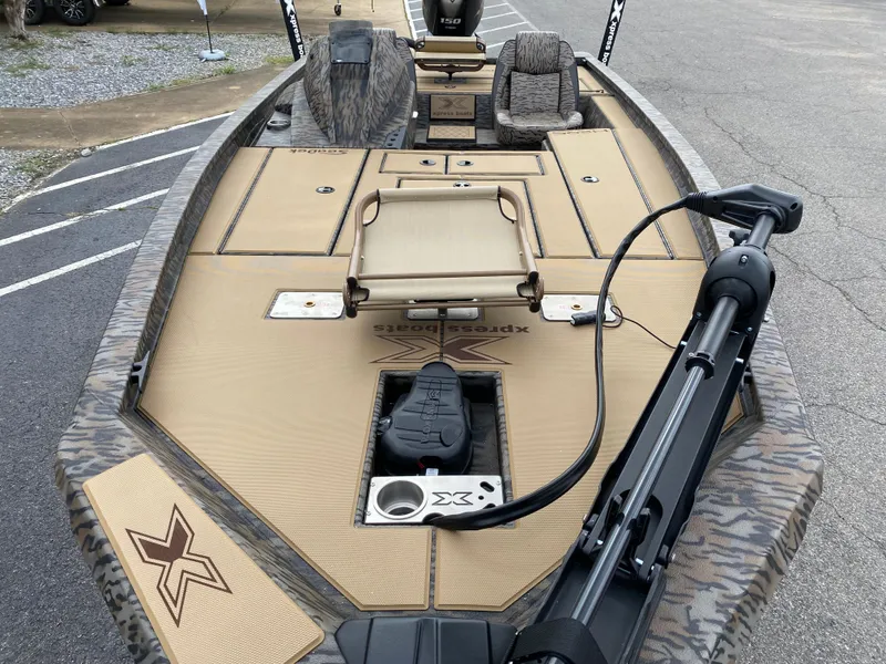 Slide: The Image of 2025 Xpress H20C Crappie boat with tan deck and fishing seats. - 7