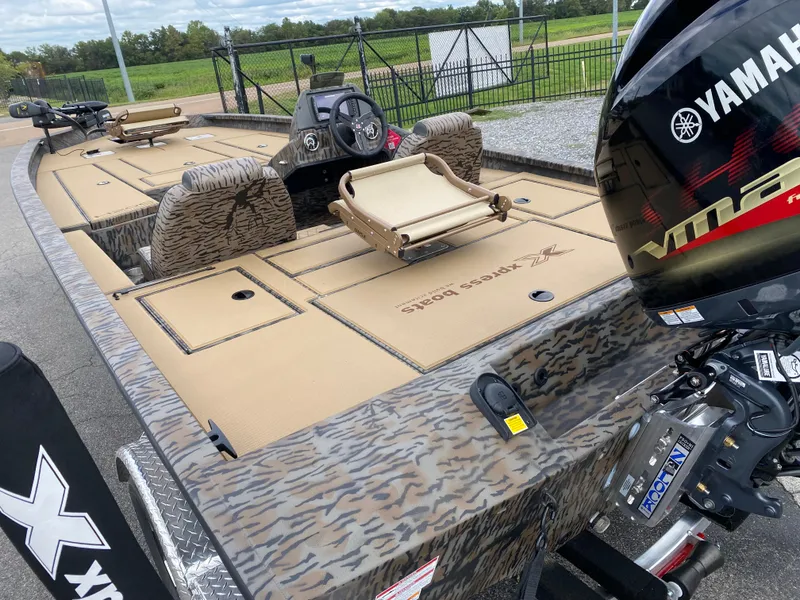 Slide: The Image of 2025 Xpress H20C Crappie boat with Yamaha motor, featuring camo design and spacious seating. - 8