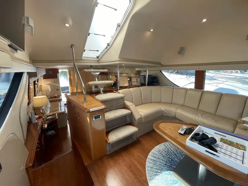 Slide: The Image of Luxurious interior of 2006 Carver 56 Voyager yacht with plush seating and modern amenities. - 14