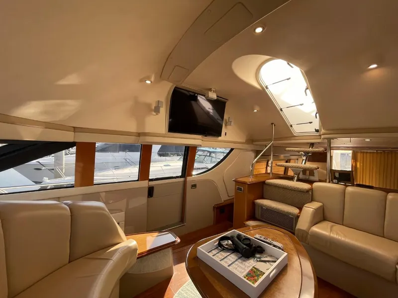 Slide: The Image of Luxurious interior of 2006 Carver 56 Voyager yacht with plush seating and skylight. - 18