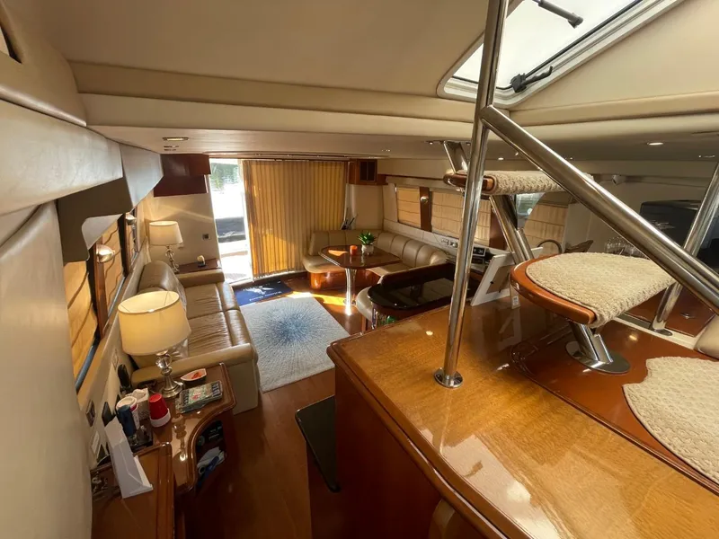 Slide: The Image of Luxurious interior of 2006 Carver 56 Voyager yacht with elegant seating and natural light. - 20