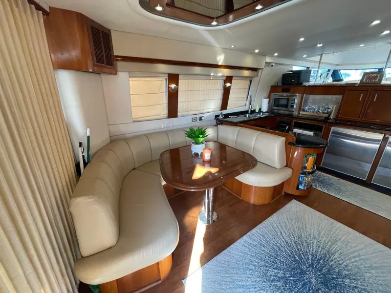 Slide: The Image of Luxurious interior of 2006 Carver 56 Voyager yacht with elegant dining area and modern kitchen. - 24