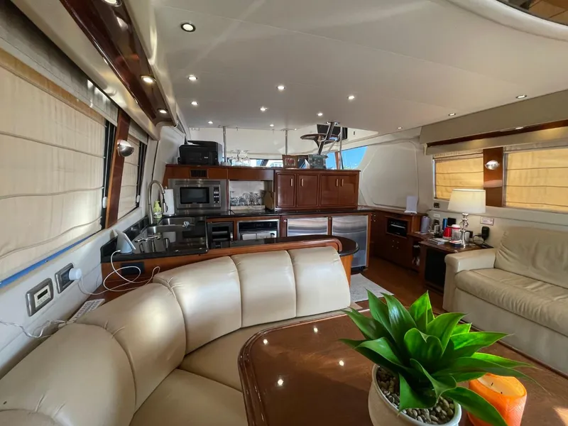 Slide: The Image of Luxurious interior of 2006 Carver 56 Voyager yacht with modern kitchen and seating area. - 25