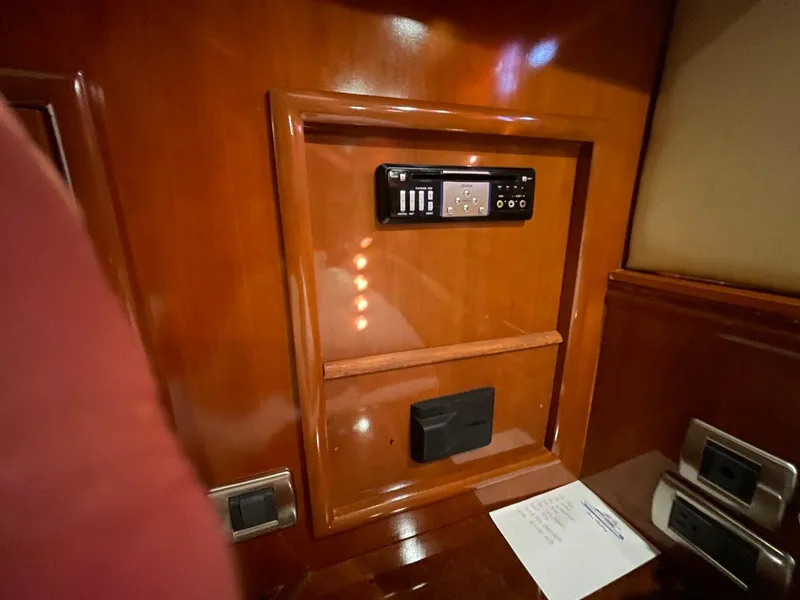 Slide: The Image of 2006 Carver 56 Voyager interior with control panel and wood finish. - 46