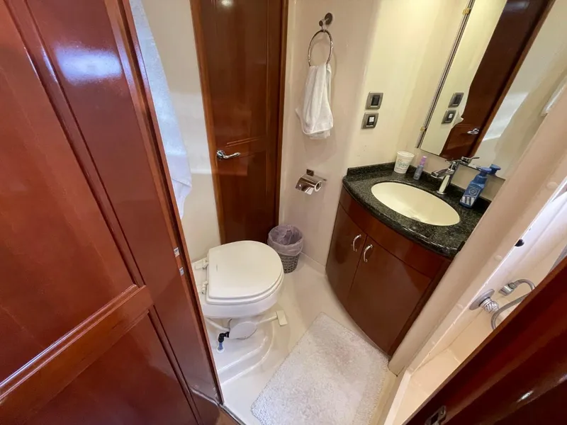 Slide: The Image of Luxurious bathroom in 2006 Carver 56 Voyager yacht with wood accents and modern fixtures. - 47