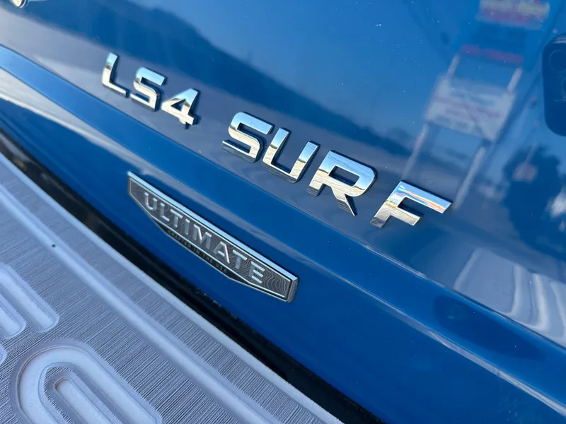 Slide: The Image of 2025 Regal LS4 Surf boat emblem, close-up view. - 11