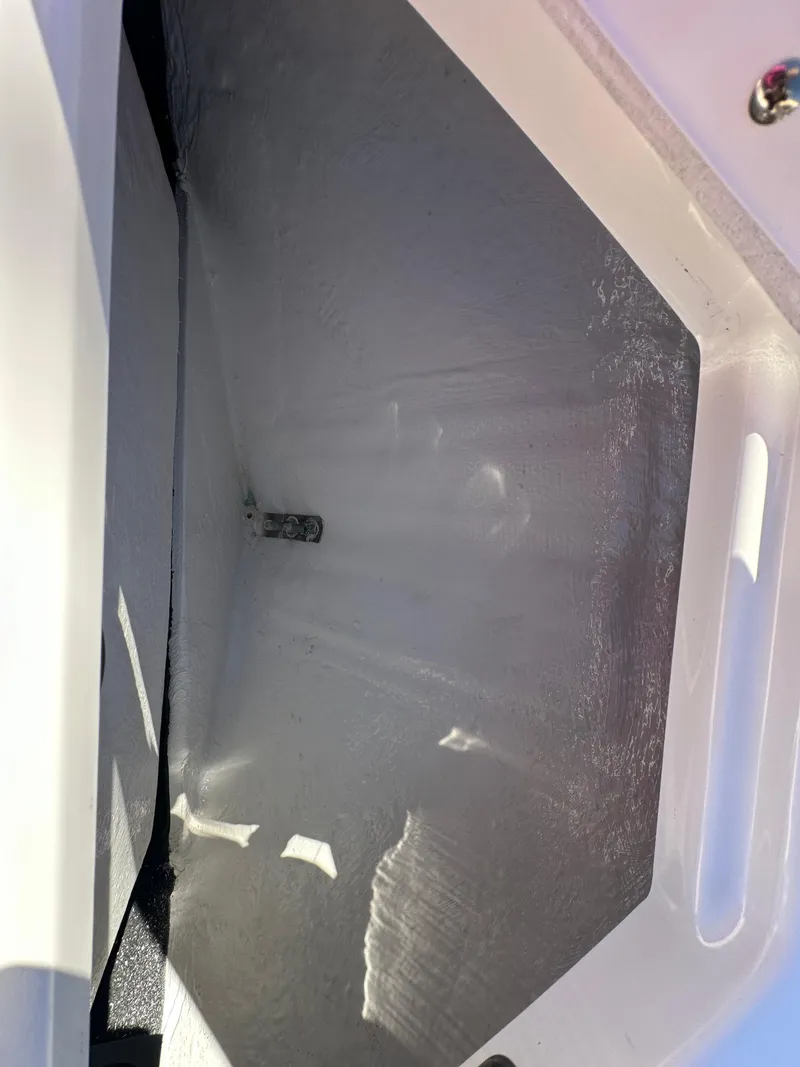 Slide: The Image of 2025 Regal LS4 Surf boat storage compartment, empty and clean. - 23