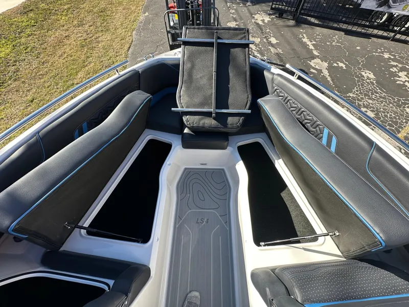 Slide: The Image of 2025 Regal LS4 Surf boat interior with sleek seating and modern design. - 26