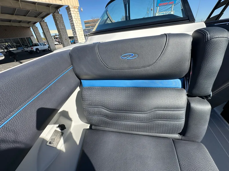 Slide: The Image of 2025 Regal LS4 Surf boat seat with blue accents and sleek design. - 32