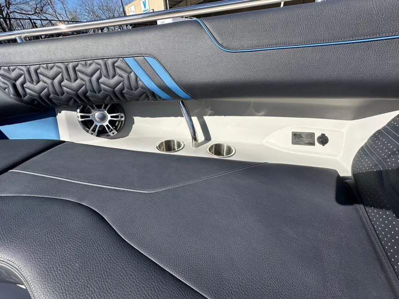 Slide: The Image of 2025 Regal LS4 Surf boat interior with speaker and stylish upholstery. - 33