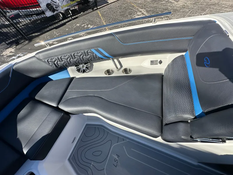 Slide: The Image of 2025 Regal LS4 Surf boat interior with black and blue seating and modern design. - 35