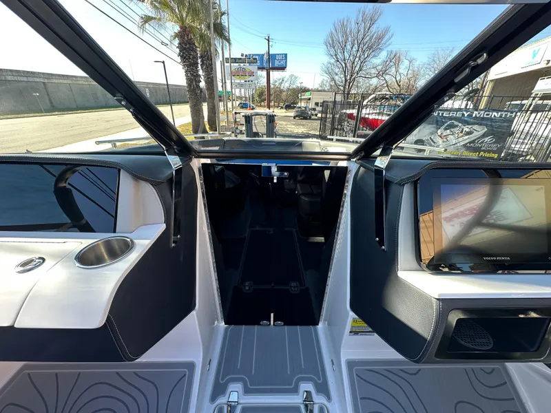Slide: The Image of 2025 Regal LS4 Surf boat interior with modern dashboard and sleek design. - 45