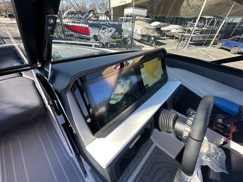 Slide: The Image of 2025 Regal LS4 Surf boat dashboard with modern touchscreen display. - 47