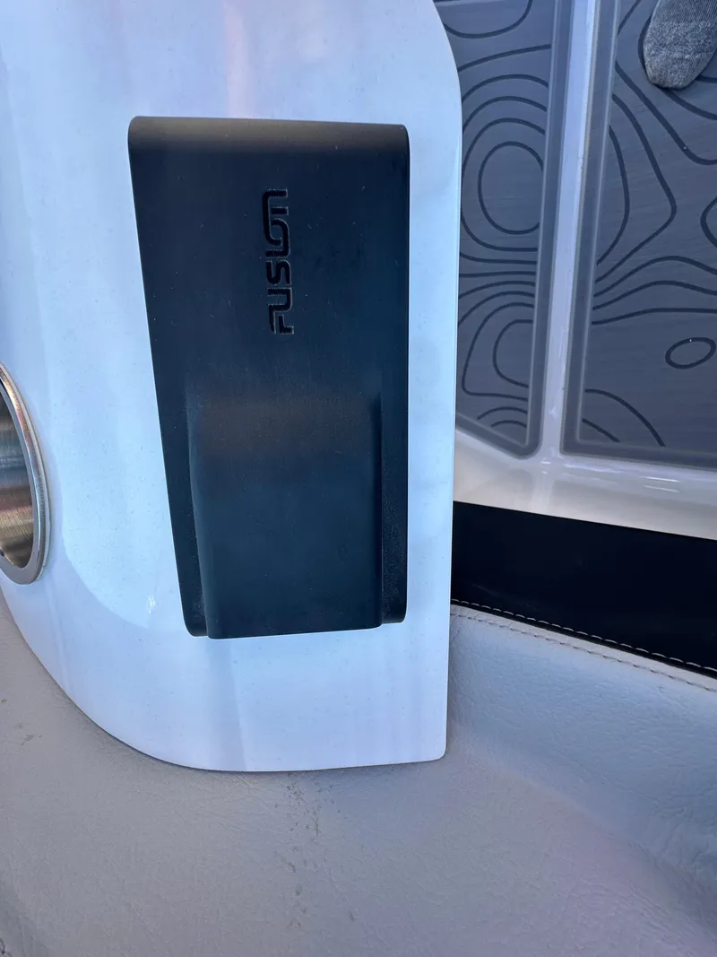 Slide: The Image of 2025 Regal LS4 Surf boat interior detail with Fusion audio component. - 49