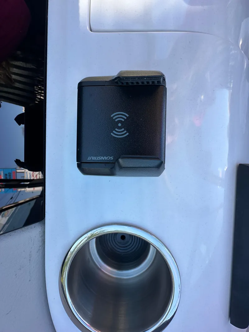 Slide: The Image of 2025 Regal LS4 Surf boat with wireless charging pad and cup holder. - 50