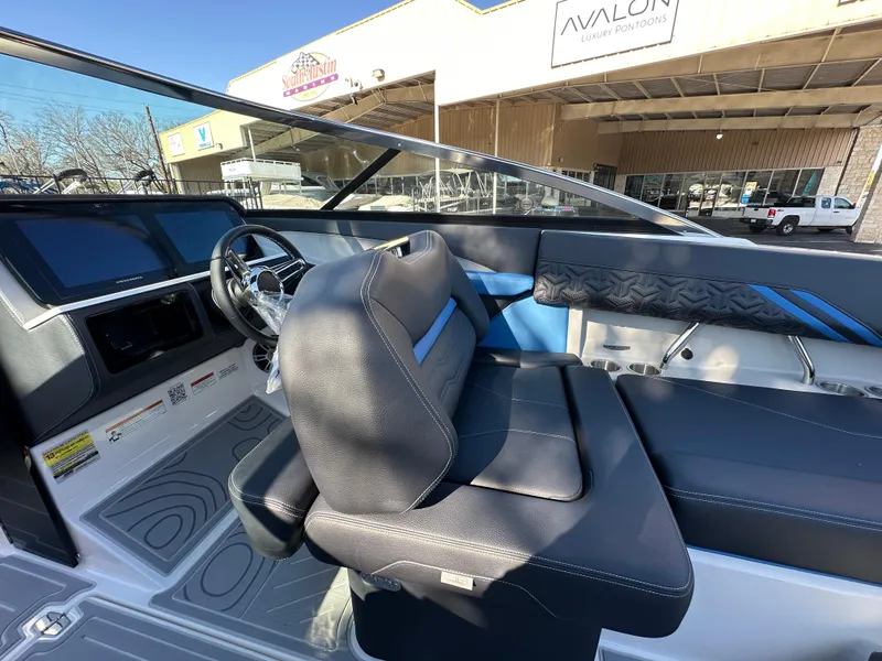 Slide: The Image of 2025 Regal LS4 Surf boat interior with modern dashboard and seating. - 57