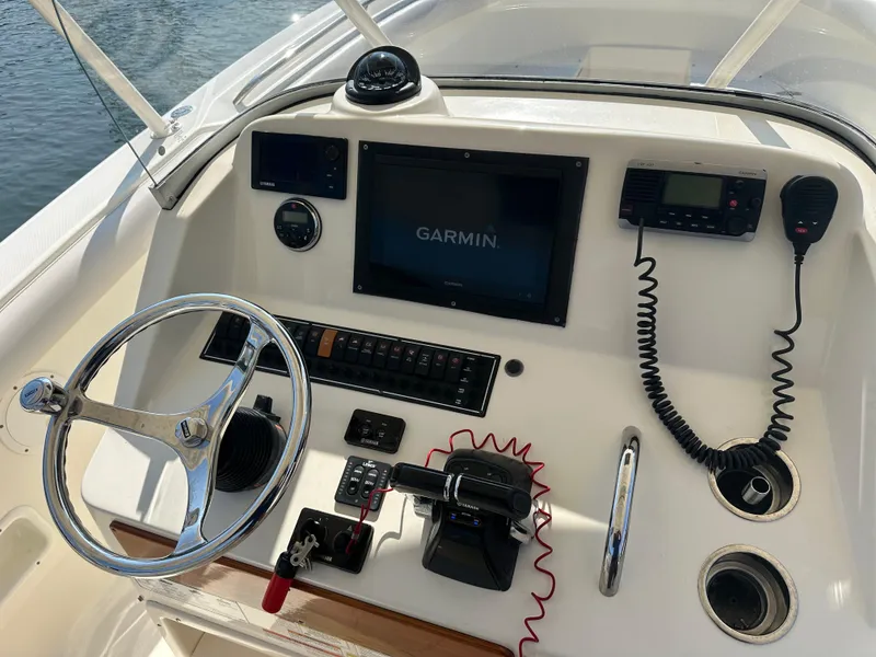 Slide: The Image of Control panel of 2014 Pursuit S 280 Sport boat with Garmin navigation system. - 11
