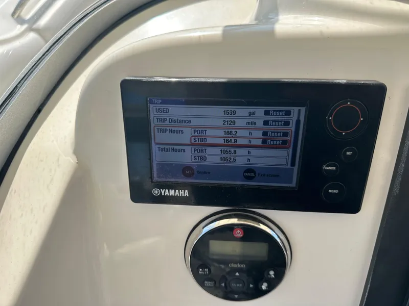 Slide: The Image of Dashboard of a 2014 Pursuit S 280 Sport boat showing trip data on a Yamaha display. - 12