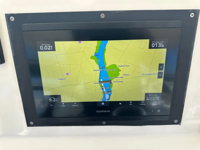 Slide: The Image of Garmin navigation display on 2014 Pursuit S 280 Sport boat, showing a detailed map. - 13