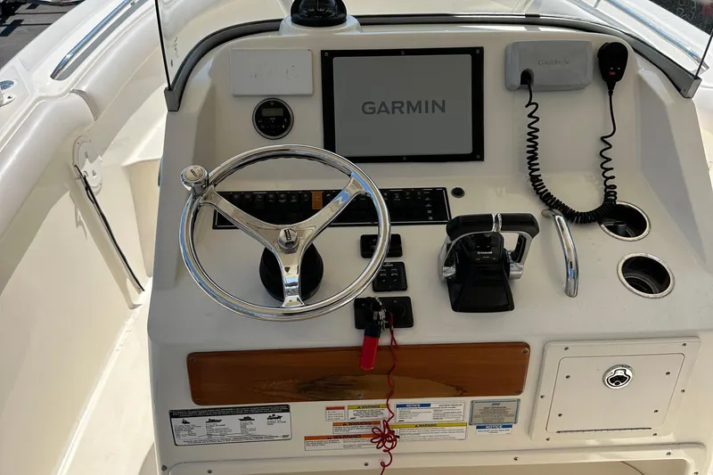 Slide: The Image of 2014 Pursuit S 280 Sport boat dashboard with Garmin navigation system. - 15