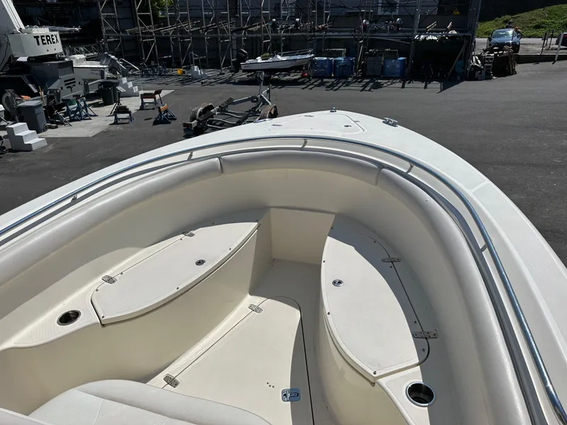 Slide: The Image of 2014 Pursuit S 280 Sport boat interior with seating and storage compartments. - 8
