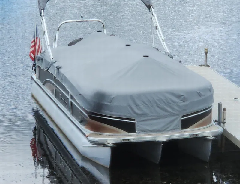Slide: The Image of Covered 2012 Premier Solaris pontoon boat docked on calm water. - 5