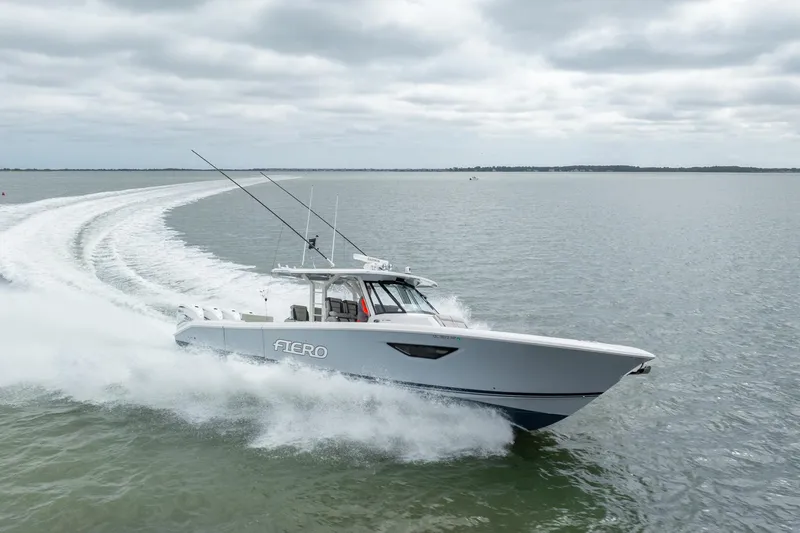 Slide: The Image of 2023 Pursuit S 428 Sport boat cruising on open water. - 11