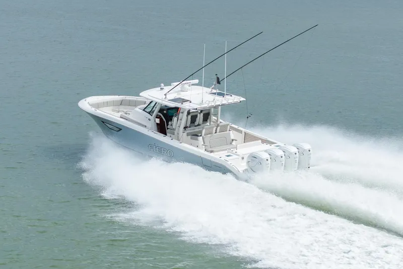 Slide: The Image of 2023 Pursuit S 428 Sport boat speeding on water, showcasing powerful engines and sleek design. - 15