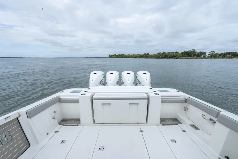 Slide: The Image of 2023 Pursuit S 428 Sport boat with quad engines on open water. - 21