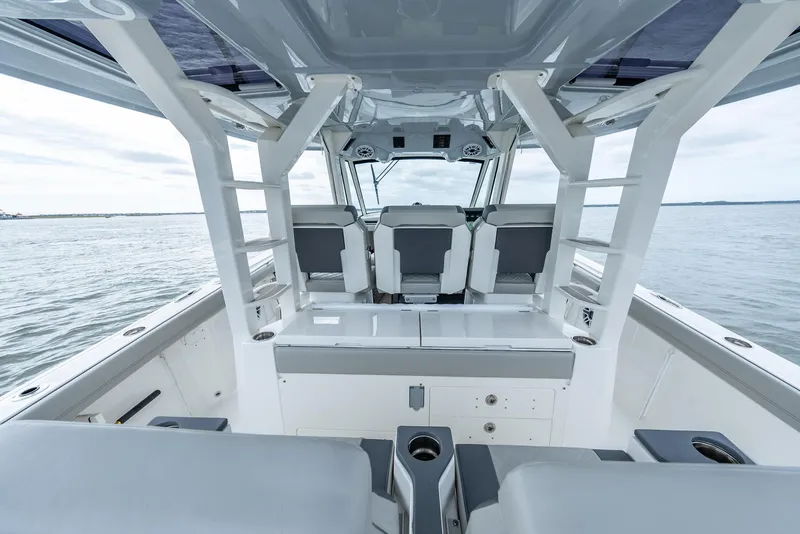 Slide: The Image of 2023 Pursuit S 428 Sport boat interior with sleek seating and open deck design. - 27