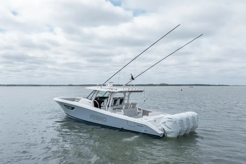 Slide: The Image of 2023 Pursuit S 428 Sport boat on calm water with fishing rods. - 3