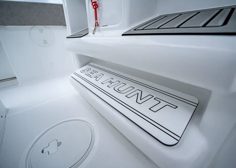Slide: The Image of 2025 Sea Hunt Ultra 239 SE boat interior with branded step detail. - 14