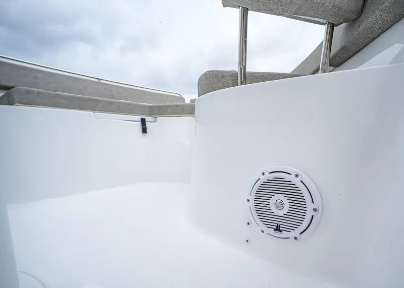 Slide: The Image of 2025 Sea Hunt Ultra 239 SE boat interior with speaker and seating. - 21