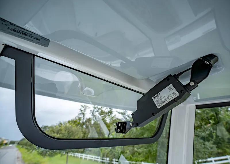 Slide: The Image of Interior view of 2025 Sea Hunt Ultra 239 SE boat with advanced window mechanism. - 24