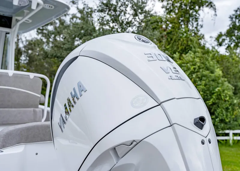 Slide: The Image of 2025 Sea Hunt Ultra 239 SE with Yamaha 300 V6 engine, outdoor setting. - 3
