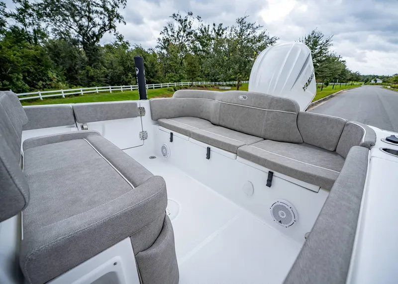 Slide: The Image of 2025 Sea Hunt Ultra 239 SE boat interior with gray seating and white deck. - 5