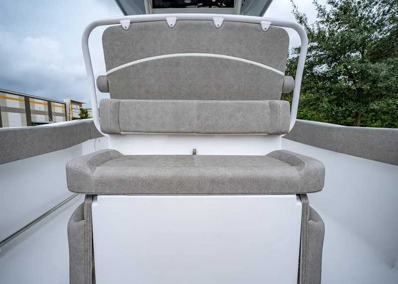 Slide: The Image of 2025 Sea Hunt Ultra 239 SE boat seating, gray upholstery, outdoor setting. - 7